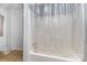 Bathroom featuring a shower/tub combo with clear shower curtain at 400 37Th Sw St, Hickory, NC 28602