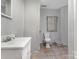 Bathroom featuring a single vanity, toilet, and unfinished drywall walls at 400 37Th Sw St, Hickory, NC 28602