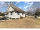 Side view of a single story home with modern vinyl siding and covered parking at 400 37Th Sw St, Hickory, NC 28602