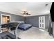 The large primary bedroom features neutral paint, carpeted floors, a ceiling fan, and closet space at 400 37Th Sw St, Hickory, NC 28602