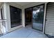 Private outdoor balcony featuring a sliding glass door entry and a view of neighborhood at 4814 Spring Lake E Dr, Charlotte, NC 28212