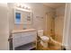 Cozy bathroom featuring a single sink vanity and shower/tub at 4814 Spring Lake E Dr, Charlotte, NC 28212