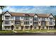 Charming new townhome with a modern design and well-manicured front lawn at 521 Annie Lowery Way, Davidson, NC 28036
