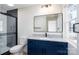 Updated bathroom with modern shower, stylish tile, black hardware, and vanity with granite countertop at 527 Crowell Ave, Statesville, NC 28677