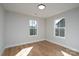 Bright bedroom with hardwood floors and two windows offering natural light at 527 Crowell Ave, Statesville, NC 28677