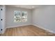 Sun-filled bedroom with wood floors and double windows offering a bright, airy feel at 527 Crowell Ave, Statesville, NC 28677