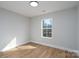 Empty bedroom featuring hardwood floors, white trim, and a bright window at 527 Crowell Ave, Statesville, NC 28677