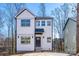 Two-story modern farmhouse with white siding, black trim, and a welcoming front entrance at 527 Crowell Ave, Statesville, NC 28677