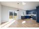 Modern kitchen with stainless appliances, blue cabinets, and an adjacent dining area at 527 Crowell Ave, Statesville, NC 28677