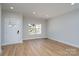 Bright living room boasts natural light, wood floors, and an entrance door at 527 Crowell Ave, Statesville, NC 28677