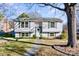 Charming two-story home featuring a well-maintained lawn and a walkway leading to the front door at 5304 Split Oak Dr, Charlotte, NC 28227