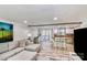 Open concept living space with seating, a bar, and access to the screened in porch at 5304 Split Oak Dr, Charlotte, NC 28227