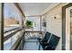Covered porch offering outdoor seating, with wood flooring, a ceiling, security camera, and a hanging plant at 5304 Split Oak Dr, Charlotte, NC 28227