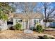 Charming shed with gray roof, white trim, flower boxes, and surrounding landscaping, adding functionality and charm at 5304 Split Oak Dr, Charlotte, NC 28227