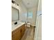 Stylish bathroom featuring a modern vanity, fixtures, and wood-look flooring at 613 Granite Ave, Gastonia, NC 28052