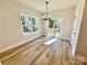 Elegant dining room featuring a modern chandelier and sliding glass doors to a deck at 613 Granite Ave, Gastonia, NC 28052