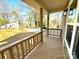 Spacious covered front porch with wood railings, offering a relaxing outdoor space at 613 Granite Ave, Gastonia, NC 28052