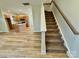 Open-concept living space featuring a modern kitchen, staircase, and contemporary design elements at 613 Granite Ave, Gastonia, NC 28052