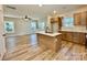 Bright, open kitchen with island, white countertops and stainless steel appliances at 613 Granite Ave, Gastonia, NC 28052