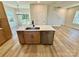 Modern kitchen island with stainless steel appliances, ample cabinet space, and an open-concept design at 613 Granite Ave, Gastonia, NC 28052