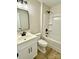 Bathroom featuring a single sink vanity, black hardware, and a shower-tub combination at 620 Granite Ave, Gastonia, NC 28052