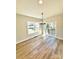 Bright dining room with wood floors, modern chandelier, and sliding glass doors to the deck at 620 Granite Ave, Gastonia, NC 28052