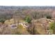 Aerial view of home in a quiet neighborhood with mature trees at 621 E Sharpe St, Statesville, NC 28677