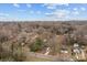 Aerial view of home in a quiet neighborhood with mature trees at 621 E Sharpe St, Statesville, NC 28677