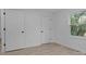 Freshly painted bedroom with new floors, closet and a view of the outdoors from the window at 621 E Sharpe St, Statesville, NC 28677