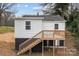 Exterior view of home with a wooden deck and stairs at 621 E Sharpe St, Statesville, NC 28677