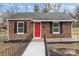 Charming brick home with a vibrant red front door at 621 E Sharpe St, Statesville, NC 28677