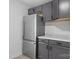 This kitchen features gray cabinetry, stainless steel appliances, and marble countertops at 621 E Sharpe St, Statesville, NC 28677