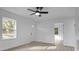 Bright living room with new flooring, fresh paint, a ceiling fan and abundant natural light at 621 E Sharpe St, Statesville, NC 28677