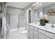 Modern bathroom with a glass-enclosed shower, double sink vanity, and stylish tile flooring at 7216 Hodges Meadow Ln, Charlotte, NC 28213