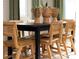 Bright dining room featuring a dark wooden table, seating for six, and natural decor at 7216 Hodges Meadow Ln, Charlotte, NC 28213