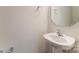 Bright powder room featuring a white sink, round mirror, and modern fixtures at 7216 Hodges Meadow Ln, Charlotte, NC 28213