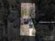 An aerial view shows the property's layout, including the house, driveway, and treed lot at 8082 Golf Course N Dr, Denver, NC 28037