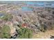Scenic aerial view of a lakeside community with lush trees and sparkling water for relaxation at 8082 Golf Course N Dr, Denver, NC 28037