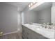 Elegant bathroom featuring a double sink vanity with marble countertop and gray cabinetry at 8082 Golf Course N Dr, Denver, NC 28037