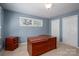 Versatile room with desk, neutral carpet, window, and closets for a home office or den at 8082 Golf Course N Dr, Denver, NC 28037