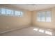 Bright bedroom featuring neutral walls, carpet, natural light, and a ceiling fan at 8082 Golf Course N Dr, Denver, NC 28037