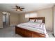 Comfortable bedroom with a ceiling fan, soft carpet, and a neutral color scheme at 8082 Golf Course N Dr, Denver, NC 28037