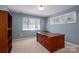 Spacious room with desk, natural light, and storage solutions. Perfect for a home office at 8082 Golf Course N Dr, Denver, NC 28037