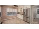 Bright breakfast area adjacent to the kitchen featuring ample natural light and tile flooring at 8082 Golf Course N Dr, Denver, NC 28037