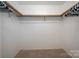 Walk-in closet with clothing rails on all sides, offering ample storage space at 8082 Golf Course N Dr, Denver, NC 28037
