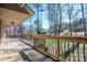 A sprawling covered deck offering outdoor living space and backyard views at 8082 Golf Course N Dr, Denver, NC 28037
