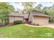 Charming two-story home featuring a well-manicured front lawn and an attached two-car garage at 8082 Golf Course N Dr, Denver, NC 28037