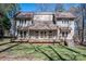 Back exterior showing home and deck with stairs to backyard at 8082 Golf Course N Dr, Denver, NC 28037