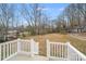 Backyard view from a deck with a lawn and treeline in the background at 834 N Flint St, Lincolnton, NC 28092