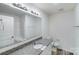 Bathroom featuring granite countertops, a sink, a toilet, and a large mirror at 834 N Flint St, Lincolnton, NC 28092